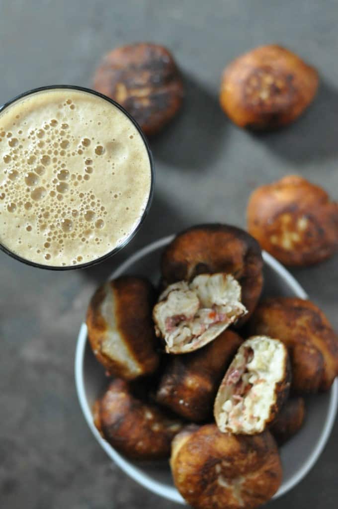 Reuben Donuts made with cooked corned beef, sauerkraut, swiss cheese and Thousand Island dressing tucked inside biscuit dough and deep fried. Recipe here: https://diningwithalice.com/appetizers/reuben-donuts/