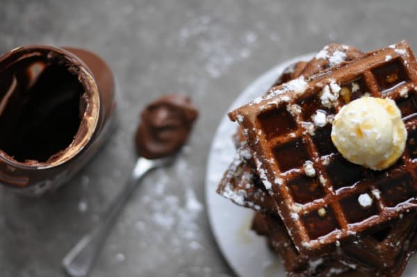 Tater Tot Waffles recipe makes a savory waffle perfect for a burger, grilled cheese or eggs. Only three ingredients and made on your waffle iron. https://diningwithalice.com/comfort-foods/tater-tot-waffles/