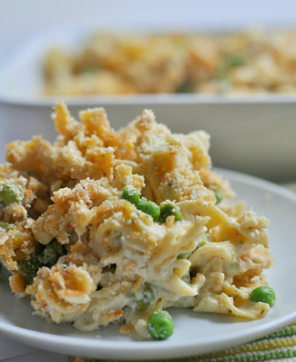 Easy Chicken Noodle Casserole recipe made with a creamy garlic and parmesan sauce, rotisserie chicken and topped with a buttery cracker topping. https://diningwithalice.com/weeknight-meals/chicken-noodle-casserole/