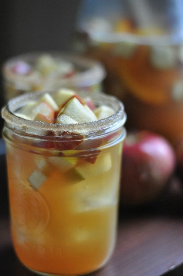 Super easy apple cider sangria made with sparkling wine and bourbon soaked apples and pears. Fall cocktail: https://diningwithalice.com/drinks/apple-cider-sangria-with-bourbon/