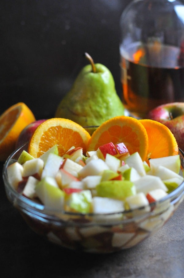 Super easy apple cider sangria made with sparkling wine and bourbon soaked apples and pears. Fall cocktail: https://diningwithalice.com/drinks/apple-cider-sangria-with-bourbon/