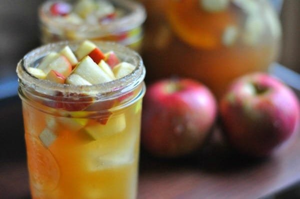 Super easy apple cider sangria made with sparkling wine and bourbon soaked apples and pears. Fall cocktail: https://diningwithalice.com/drinks/apple-cider-sangria-with-bourbon/