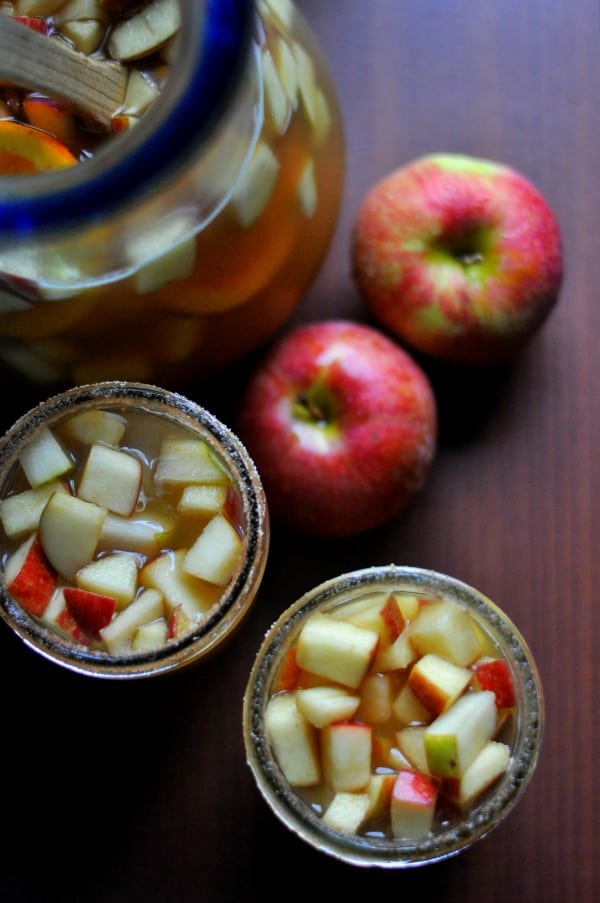 Super easy apple cider sangria made with sparkling wine and bourbon soaked apples and pears. Fall cocktail: https://diningwithalice.com/drinks/apple-cider-sangria-with-bourbon/