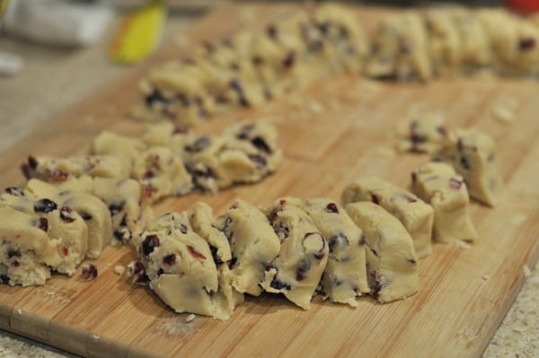 Easy recipe to make White Chocolate Cranberry Cookies. A buttery shortbread cookie with pops of lemon and cranberry and then dipped in white chocolate.