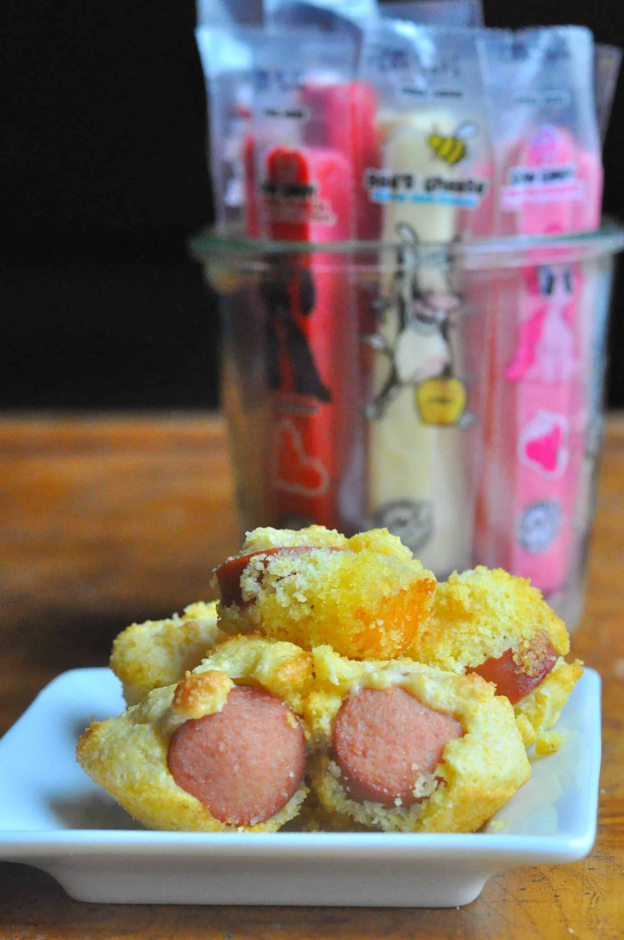 Cheesy Mini Corn Dog Muffins Cow Candy Easy Kids Recipe A super easy Cheesy Mini Corn Dog Muffins recipe that makes a great weeknight meal, fun school lunch, or game day appetizer. https://diningwithalice.com/kids/cheesy-mini-corn-dog-muffins/