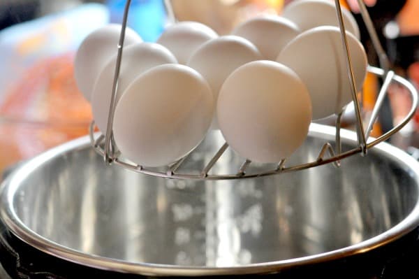 Instant Pot Hard Boiled Eggs Rack Dozen A simple recipe for making Instant Pot hard boiled eggs. It's an easy way to make big batches of hard boiled eggs and help with meal planning. This easy recipe makes delicious hard boiled eggs perfect for breakfast, lunch or to use in your favorite Egg Salad or Deviled Egg recipes. https://diningwithalice.com/instant-pot/instant-pot-hard-boiled-eggs/