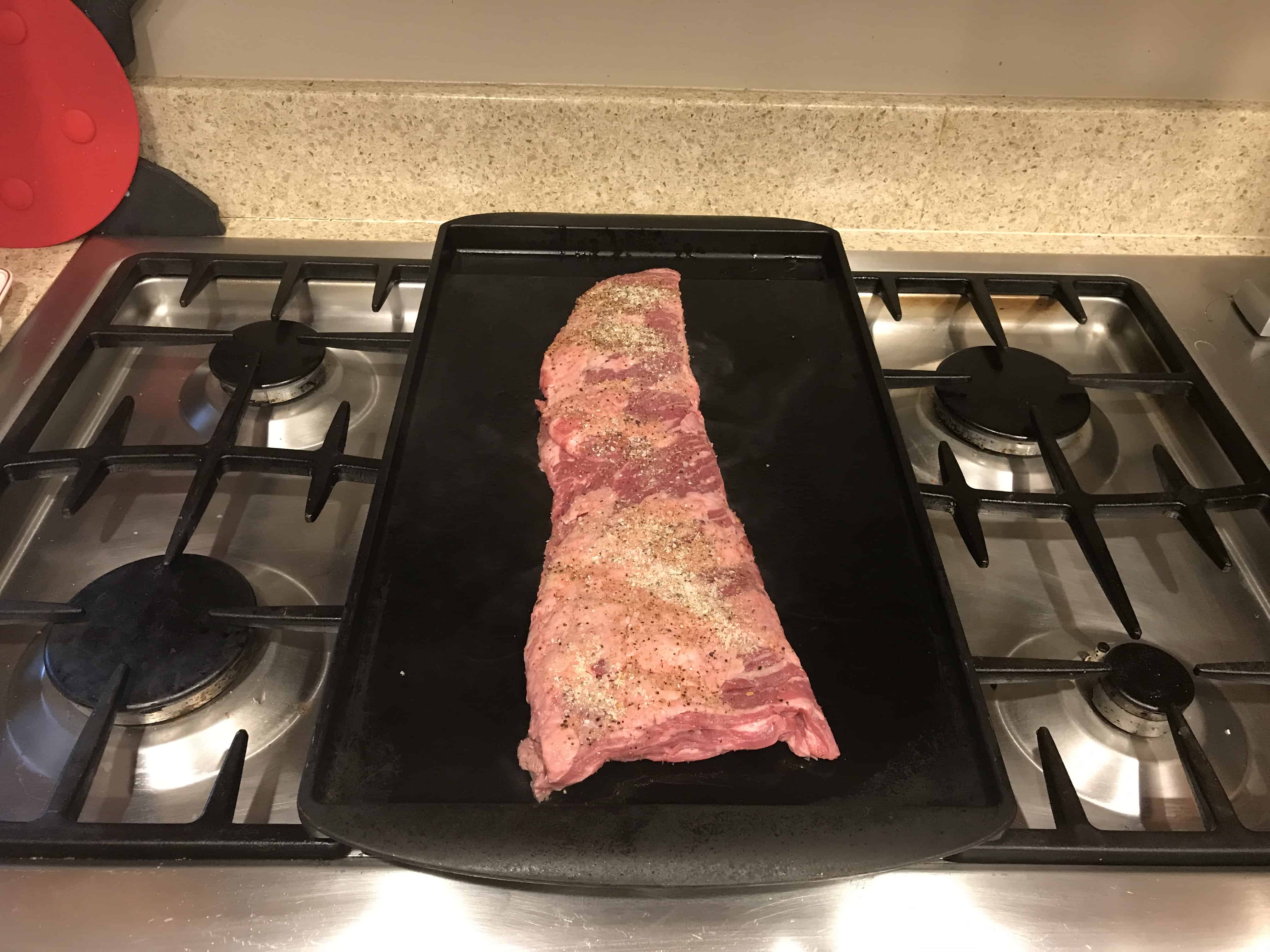 Thai Steak Salad Skirt Steak cooking on a griddle.