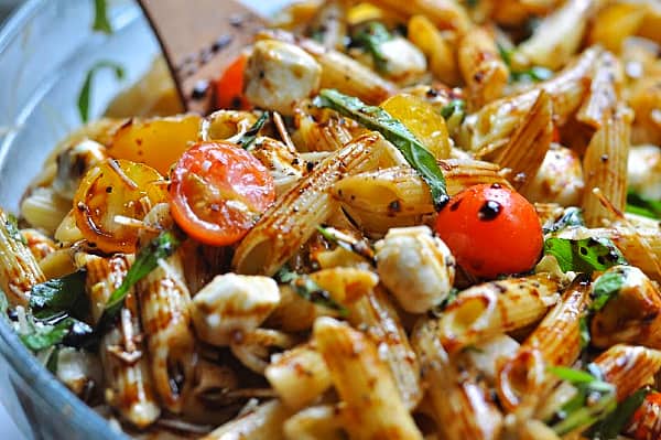 Caprese pasta salad recipe is an easy make-ahead dish for weeknight dinner or potlucks. Made with basil, mozzarella, tomatoes, and balsamic glaze.