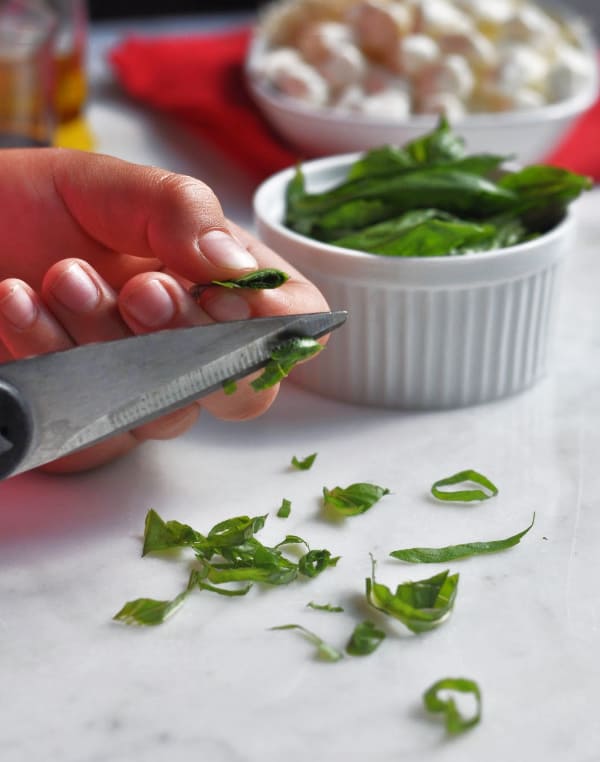 Caprese pasta salad chiffonading basil instructions