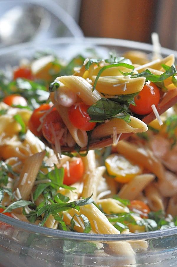 Caprese pasta salad recipe is an easy make-ahead dish for weeknight dinner or potlucks. Made with basil, mozzarella, tomatoes, and balsamic glaze.