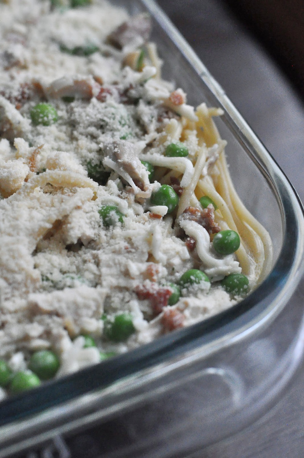 close up of bacon and peas Original Turkey Tetrazzini recipe with leftover turkey and a cream cheese sauce! A traditional Turkey Tetrazzini recipe great for a crowd!