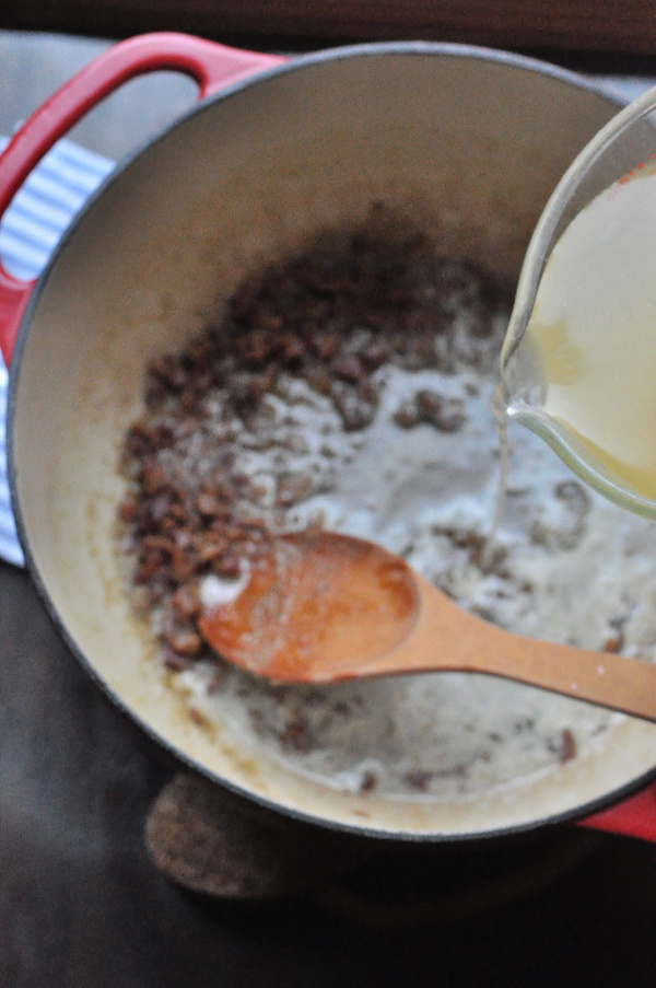 chicken broth being poured into a stock pot, Original Turkey Tetrazzini recipe with leftover turkey and a cream cheese sauce! A traditional Turkey Tetrazzini recipe great for a crowd!