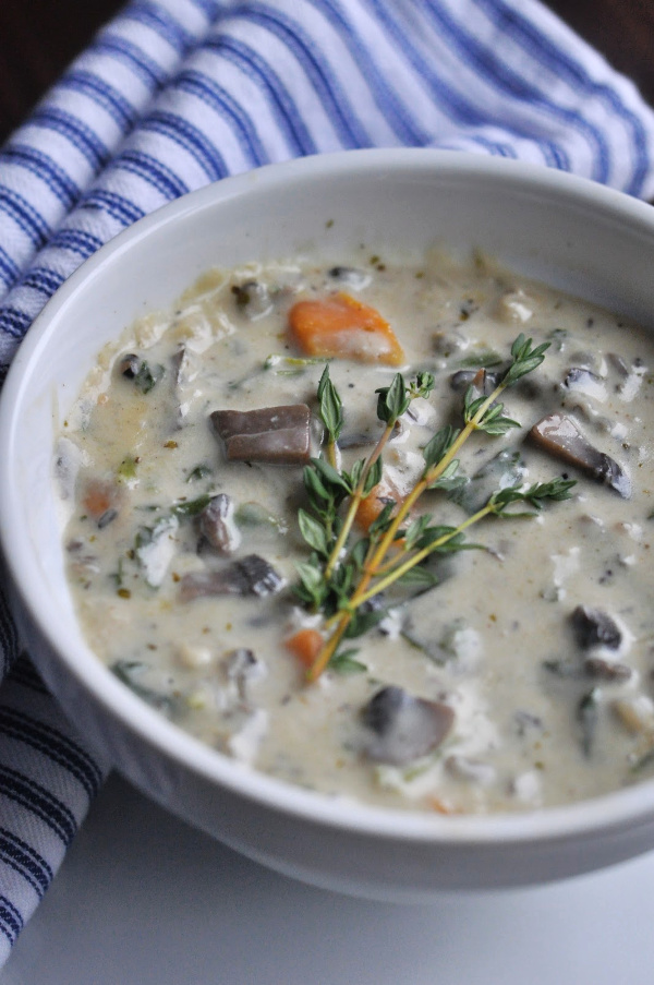 Bowl of Creamy Vegetarian Wild Rice Soup with portabella mushrooms and sweet potatoes